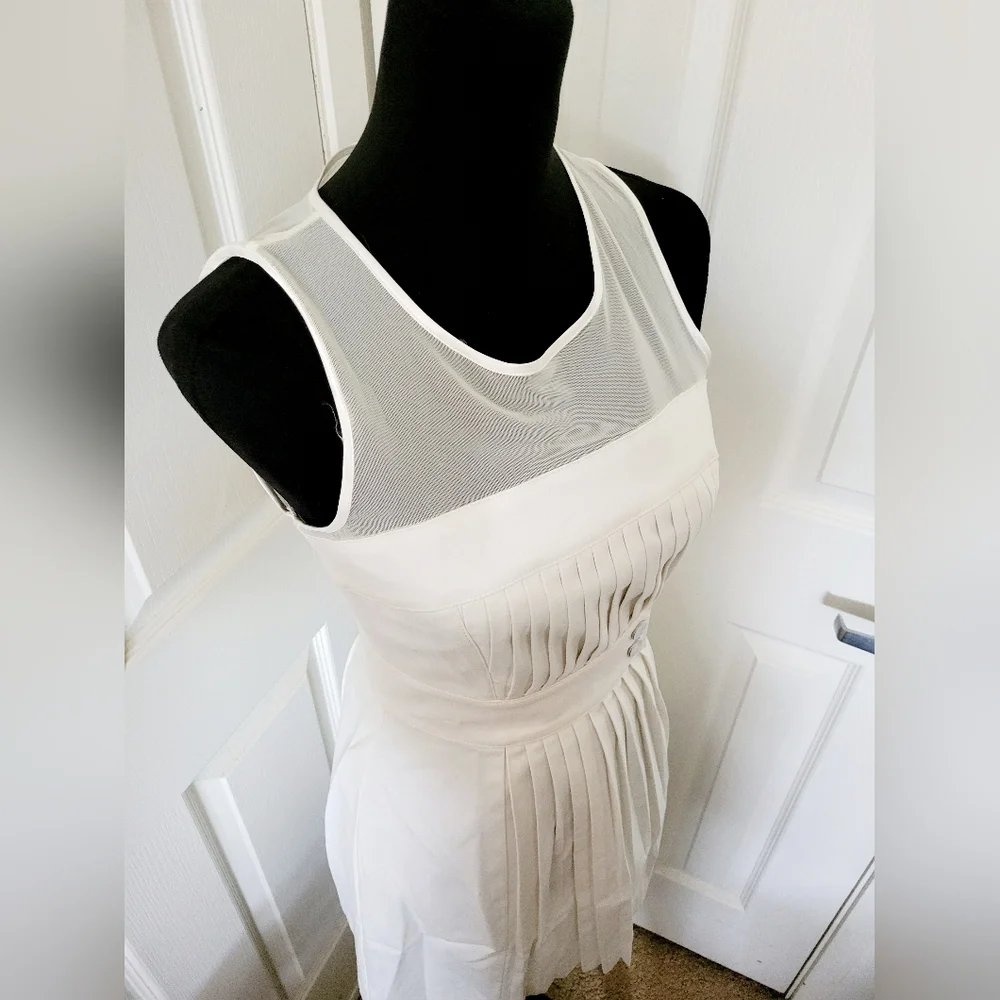 Bebe | Cute Ivory Pleated Sleeveless Fit & Flare Cocktail Dress - Picture 2 of 15